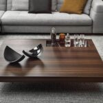 BOTECO coffee table by MARCIO KOGAN (studio mk27), designed in 2020. The clever juxtaposition of different materials and their combination, creating an elegantly harmonious look, are the result of the research done by the Brazilian design studio, supported by MinottiI‚Äôs know-how to manage joint projects.