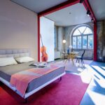 BED GRANGALA BY GABRIELE ROSA  2018.STEEL FEET AND SHELVES COVERED WITH COWHIDE PIGMETATO 90. STEEL FRAME WITH SUSPENSION ON NATURAL BENT BEECH STRIPS. BASE AND HEADBOARD UPHOLSTERED IN POLYURETHANE/HEAT-BOUND POLYESTER FIBRE. REMOVABLE FABRIC OR LEATHER COVER. UPON REQUEST THE MODELS WITH SEPARATE SPRINGING AND THE BED SIZES FOR 210 CM. AND 220 CM. LONG MATTRESSES ARE AVAILABLE.