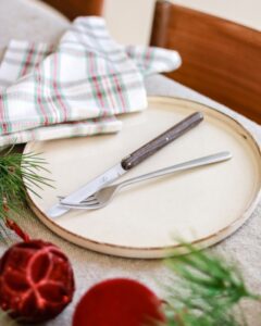 STEAK KNIFE by ANDR√âE PUTMAN.Designed by ANDR√âE PUTMAN and her daughter OLIVIA as part of the STUDIO PUTMAN, this series of knives for FORGE de LAGUIOLE reinterprets in an absolutely personal way and with brilliance, two identifying signs of an ancestral cutlery tradition, the straight handle and the Bourbonnaise blade with a centered point. Available in ebony or densified ash, this timeless knife has the simple yet refined elegance characteristic of the maker who also rediscovered the furniture of the 1930s by reissuing its greatest signatures. The knife has conquered the most demanding tables.