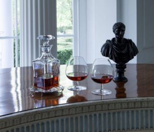 PERFECTION whiskey decanter. With the PERFECTION collection, the name says it all. As far back as Greek mythology, Pygmalion sought to sculpt to the perfect form of a woman; in the same storied fashion, the Perfection collection is expertly crafted by the modern Pygmalions, the most respected artisans of the m√©tier with supreme mastery of Baccarat‚Äôs flawless clear crystal. The stunning form is the perfect vessel in which to serve and enjoy a smooth drink. The diamond-cut beveled stopper crowns the decanter with geometric sophistication. The PERFECTION collection also includes champagne flutes, wine glasses, tumblers, and a pitcher.