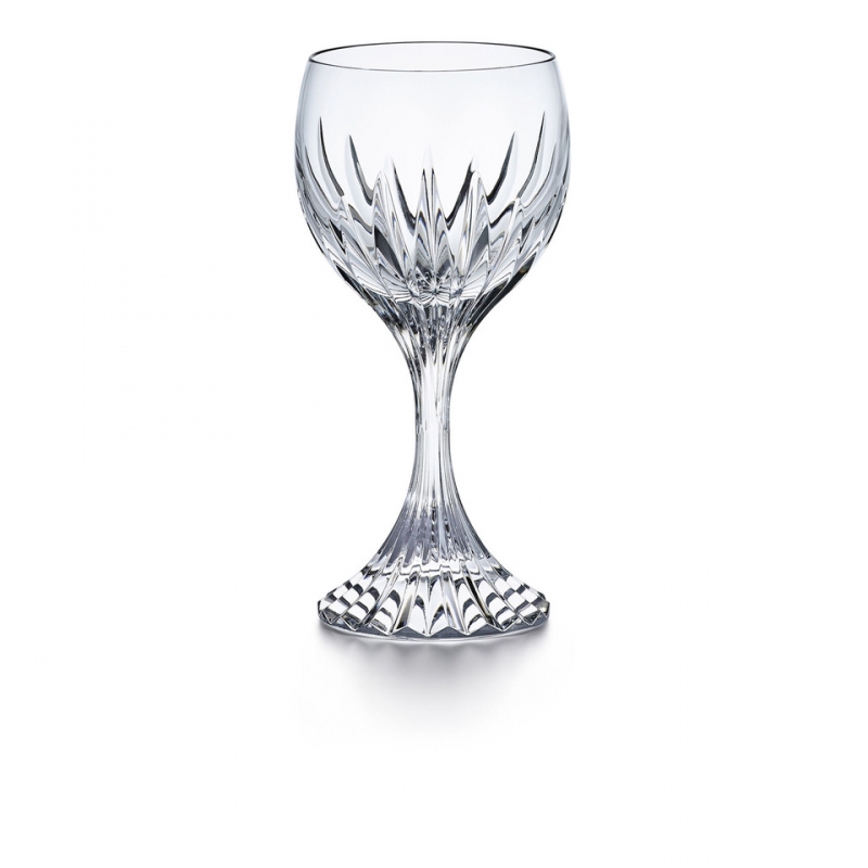 The MASSENA glass showcases Baccarat‚Äôs meticulous craftsmanship. Deep orgue bevel cuts are etched directly into the clear crystal, radiating from the foot of the glass to the base of the wide bowl. This, in turn, puts the smoothness of the upper bowl in sharp relief. The intricate detailing gives the MASSENA glass the appearance of impressive heft, as if it were a modern-day chalice. The polished silhouette and prismatic qualities make it worthy of any festive occasion or special soir√©e. The glass is just one component of the iconic MASSENA bar and tableware collection, which encompasses wine glasses, highball glasses, tumblers, and a decanter. All pieces from the MASSENA collection share a scrupulously textural quality.