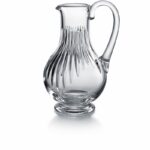Baccarat MASS√âNA pitcher. Deep orgue bevel cuts are etched directly into the clear crystal, irradiating along the ample rounded globe towards the base. Their intricacy, in turn, put the smoothness and lucidity of the upper bowl into sharp relief. The stunning silhouette and prismatic optical effects of the cuts make the MASSENA pitcher a great addition to any table, one that accents any festive occasion or special soir√©e with a luminous beauty and optical splendor. The pitcher is just one element of Baccarat‚Äôs iconic MASSENA bar and tableware collection, which encompasses wine glasses, highball glasses, and tumblers. All pieces from the MASSENA collection share scrupulously rendered orgue bevel cuts.