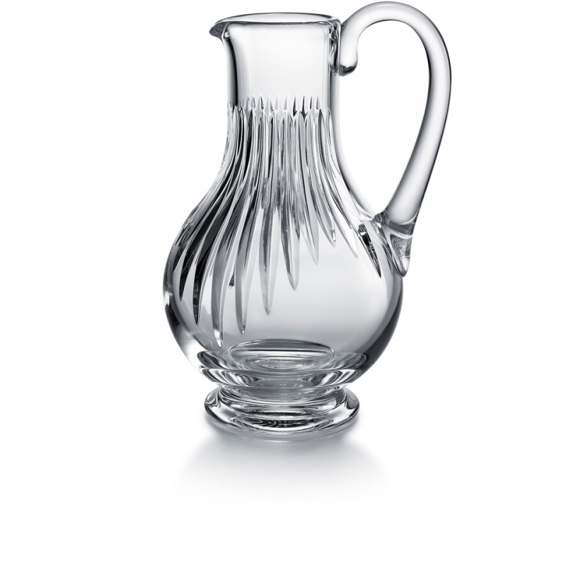 Baccarat MASS√âNA pitcher. Deep orgue bevel cuts are etched directly into the clear crystal, irradiating along the ample rounded globe towards the base. Their intricacy, in turn, put the smoothness and lucidity of the upper bowl into sharp relief. The stunning silhouette and prismatic optical effects of the cuts make the MASSENA pitcher a great addition to any table, one that accents any festive occasion or special soir√©e with a luminous beauty and optical splendor. The pitcher is just one element of Baccarat‚Äôs iconic MASSENA bar and tableware collection, which encompasses wine glasses, highball glasses, and tumblers. All pieces from the MASSENA collection share scrupulously rendered orgue bevel cuts.