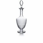 ROHAN decanter. The ROHAN collection is acid etched, giving the Baccarat crystal an elegant originality. The refined curves joined to a bevelled base make it a modern and delicate collection for the bar. The collection consists of a decanter, glasses, a champagne flute, a highball and a tumbler, and will delight liqueur and cocktail enthusiasts.