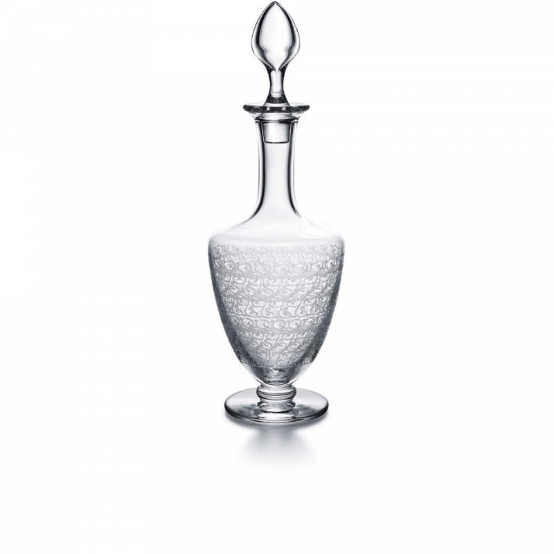 ROHAN decanter. The ROHAN collection is acid etched, giving the Baccarat crystal an elegant originality. The refined curves joined to a bevelled base make it a modern and delicate collection for the bar. The collection consists of a decanter, glasses, a champagne flute, a highball and a tumbler, and will delight liqueur and cocktail enthusiasts.