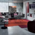 ARMCHAIR CALLA BY NO√â DUCHAUFOUR LAWRANCE 2010.BASE ON CASTORS OR FIXED WITH FEET. STEEL FRAME. UPHOLSTERY WITH SELF-EXTINGUISHING POLYURETHANE FOAM/HEAT-BOUND POLYESTER FIBRE WITH ELASTIC STRIPS SUSPENSION. REMOVABLE FABRIC OR LEATHER COVER. THE EXTERNAL BODY CAN EVEN BE COVERED WITH COWHIDE 95 COMBINED WITH FABRIC OR LEATHER. THE ARMCHAIR IS AVAILABLE IN TWO DIFFERENT HEIGHTS ABOVE GROUND LEVEL: HIGH 873/A WITH CASTORS, LOW 873/B WITH FEET.