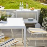 BERTOIA side chair designed by HARRY BERTOIA 1952. Dining table 1966 and serving cart 1966, designed by RICHARD SCHULTZ