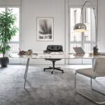 A home office for the aesthete. PIERO LISSONI'S GRASSHOPPER table, with its slender surface and organic form, adds a refined touch the elevated workspace.