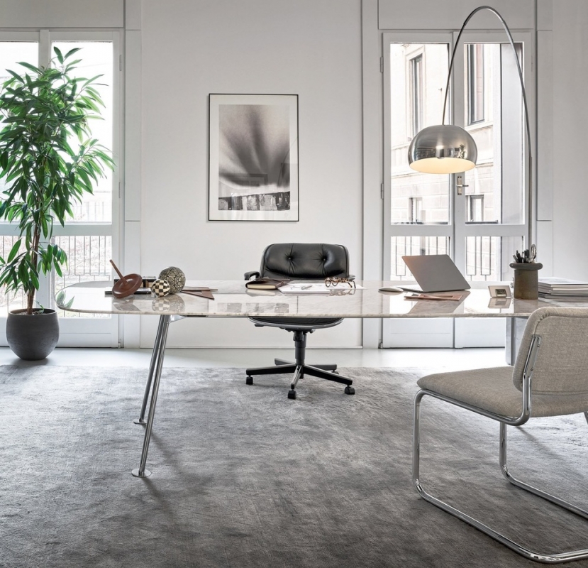 A home office for the aesthete. PIERO LISSONI'S GRASSHOPPER table, with its slender surface and organic form, adds a refined touch the elevated workspace.