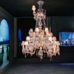 Crystal chandelier 36 lights NERVOUS ZENITH - designer LOUISE CAMPBELL, is based in clear crystal with pink, orange, red and yellow crystal elements. Available in 2 Sizes and the number of lights ranges  from 6 to 24.