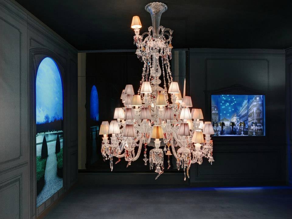 Crystal chandelier 36 lights NERVOUS ZENITH - designer LOUISE CAMPBELL, is based in clear crystal with pink, orange, red and yellow crystal elements. Available in 2 Sizes and the number of lights ranges  from 6 to 24.