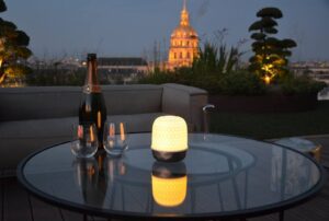 LAMPION is a LED LIGHT source that diffuses soft light through a porcelain dome, thus avoiding glare. It goes on with a touch and has three levels of light intensity. This lamp can be used indoors and outdoors to illuminate a space