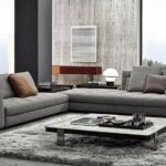 BLAZER seating system by RODOLFO DORDONI, designed in 2020. The key feature of the design is the backrest with rounded internal corners, which creates a comfortable, enveloping niche, transforming the chaise-longue element with tall backrest and armrest into a particularly welcoming alcove.