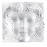 MASQUE DE FEMME PANEL,  HANDMADE CRYSTAL.THE MASQUE DE FEMME PANEL CREATED BY REN√â LALIQUE IN 1935 TO ADORN A FOUNTAIN EMBODIES THE IMAGINATIVE POWER OF ITS CREATOR WHO WAS FASCINATED BY WOMEN AND NATURE. BOTH CLASSIC AND AVANT-GARDE, THIS PIECE OF ART REVEALS THE FACE OF A MYSTERIOUS WOMAN WITH DELICATE FEATURES, SURROUNDED BY AQUATIC FAUNA.