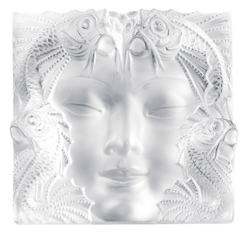 MASQUE DE FEMME PANEL,  HANDMADE CRYSTAL.THE MASQUE DE FEMME PANEL CREATED BY REN√â LALIQUE IN 1935 TO ADORN A FOUNTAIN EMBODIES THE IMAGINATIVE POWER OF ITS CREATOR WHO WAS FASCINATED BY WOMEN AND NATURE. BOTH CLASSIC AND AVANT-GARDE, THIS PIECE OF ART REVEALS THE FACE OF A MYSTERIOUS WOMAN WITH DELICATE FEATURES, SURROUNDED BY AQUATIC FAUNA.