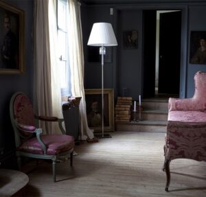 TORCH SMALL floor lamp designed by ARIK LEVY. The TORCH range draws inspiration from the exquisite Z√©nith chandelier reinventing its illustrious elements. Pairing clear crystal with shiny metal gives the product a modern feel: the long and slender polished stainless steel base is juxtaposed with dangling crystal pendants and Baccarat‚Äôs special red octagonal crystal. The lamp balances sophisticated technology with poetic whimsy and a purity, via the white shade. Its height makes it a suitable reading lamp or a standalone piece. The lamp is also available with an inverted black lampshade (placed upside down for a dash of humor), and in various other models, namely a wall sconce, and pendant light.