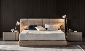 THE LAWRENCE BED PUTS A CONTEMPORARY SPIN ON THE CLASSIC UPHOLSTERED BED; BRINGING BACK BALANCED PROPORTIONS AND ADDING THE KIND OF CONSTRACTIVE DETAILS THAT SPEAK VOLUMES ABOUT MINOTTI'S ABILITY TO DESIGN AND MASTERFUL CRAFTMANSHIP. THE PADDED HEADBOARD IS DIVIDED INTO TWO SEPARETE ELEMENTS THAT COME IN TWO DIFFERENT HEIGHTS AND THREE WIDTHS; OPENING THE DOOR TO CREATIVE FREEDOM IN DESIGNING SYMMETRICAL AND ASYMMETRICAL CONFIGURATIONS AND MAKING BOLD CHOICES IN UPHOLSTERY COMBINATIONS - DESIGNE