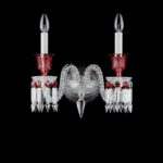 Z√âNITH RED wall sconce. Baccarat signature, the octagonal red ruby suddenly multiplies to adorn with a thousand lights the Z√âNITH clear and red crystal wall sconce in a unique and extraordinary color play. The vivid red is the result of the fusion of clear crystal and 24 K gold which gives it its vermillion luminescence. Baccarat‚Äôs red crystal sparkles with the glow of a thousand flames within the clear and flickers with all the craftsmanship and passion for perfection that went into its making. This Baccarat creation echoes the lavish coloured chandeliers in the Dolmabah√ße Palace in Istanbul which has the largest collection of Baccarat chandeliers in the world.