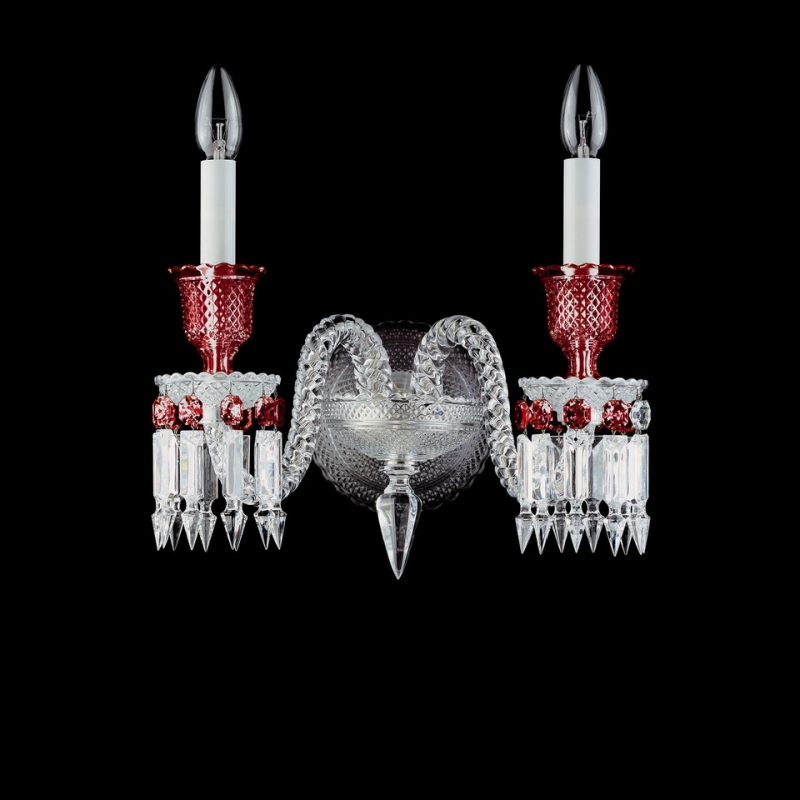 Z√âNITH RED wall sconce. Baccarat signature, the octagonal red ruby suddenly multiplies to adorn with a thousand lights the Z√âNITH clear and red crystal wall sconce in a unique and extraordinary color play. The vivid red is the result of the fusion of clear crystal and 24 K gold which gives it its vermillion luminescence. Baccarat‚Äôs red crystal sparkles with the glow of a thousand flames within the clear and flickers with all the craftsmanship and passion for perfection that went into its making. This Baccarat creation echoes the lavish coloured chandeliers in the Dolmabah√ße Palace in Istanbul which has the largest collection of Baccarat chandeliers in the world.