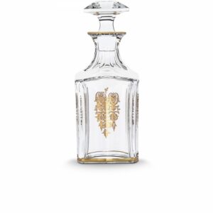 HARCOURT EMPIRE whiskey decanter. With its golden details delicately applied to the crystal, the HARCOURT EMPIRE bottle will delight whiskey lovers, for an elegant tasting. HARCOURT was created in 1841 and is the oldest service in the Baccarat catalogue. Gold motifs have been applied to each flat cut by hand, and a gold trim delicately decorates one side. The bevelled, diamond cut stopper adds a touch of geometric sophistication to this classic shape. The HARCOURT EMPIRE collection is a perfect illustration of gleaming, luminous crystal decorated with gold detail, and also includes a wine glass, a cocktail glass, a champagne flute and a wine decanter.