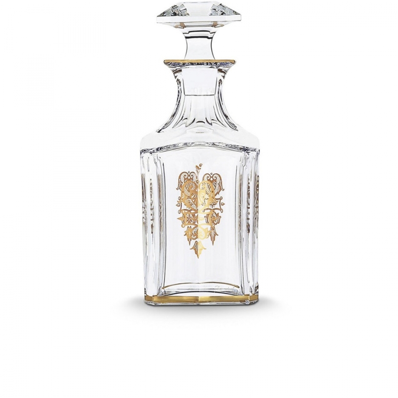 HARCOURT EMPIRE whiskey decanter. With its golden details delicately applied to the crystal, the HARCOURT EMPIRE bottle will delight whiskey lovers, for an elegant tasting. HARCOURT was created in 1841 and is the oldest service in the Baccarat catalogue. Gold motifs have been applied to each flat cut by hand, and a gold trim delicately decorates one side. The bevelled, diamond cut stopper adds a touch of geometric sophistication to this classic shape. The HARCOURT EMPIRE collection is a perfect illustration of gleaming, luminous crystal decorated with gold detail, and also includes a wine glass, a cocktail glass, a champagne flute and a wine decanter.