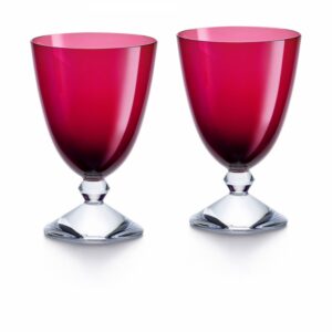 This season, our VEGA glasses have evolved into two-glass gift sets, for      every taste and in every colour. Pure and modern lines make these glasses a must for every occasion, adorning dinner tables in a mix and match of brilliant colours. The sculpted stem in the form of entwined berlingots suggests a necklace of superb pearls, reminiscent of the famous Brancusi pillars.