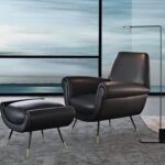 ALBERT armchair and footstool by GIGI RADICE. Minotti Historic Archive