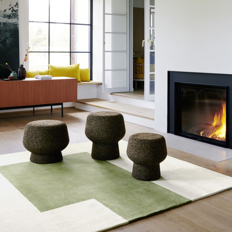 CORKER designed by HERZOG & DE MEURON, designed in 2022.The function and design of CORKER  are timeless, and its material quality is forward-looking: The cork used for the production of CORKER  in Portugal comes from local, sustainable forestry and is durable and one hundred percent recyclable. At the same time, this piece of furniture owes its inviting, velveteen haptics to the material.