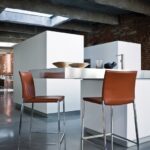 BARCHAIR  LIO BY ROBERTO BARBIERI 2005. THEY ARE THE EXTENSION OF THE LUCKY DESIGN OF LIA AND LEA CHAIRS, REMINDING BOTH THEIR SHAPE AND CONSTRUCTIONAL MATRIX: AN ELEGANT AND OUTSTANDING SIDE MADE OF ONE SINGLE ALUMINUM DIE-CAST. THEY COME WITH A PAINTED FRAME (LIO) OR ENTIRELY COVERED IN LEATHER OR COWHIDE (LEO). IN ORDER TO BETTER FIT THE VARIOUS USE SITUATIONS, HOME AND CONTRACT, THEY ARE AVAILABLE IN TWO DIFFERENT HEIGHTS.