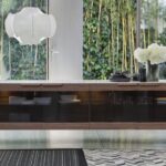 ATLANTE 6 is a sideboard from the  ATLANTE collection, crafted in solid canaletta walnut and featuring four smoked glass doors and an internal glass shelf. The smoked glass doors allow you to feature the objects within the cabinet, whilst retaining elegance, with the subtle shading of the glass and internal LED lighting. The design can be customised to suit your interior, with the cabinet‚Äôs top available in marble, wood or frosted backcoated glass.