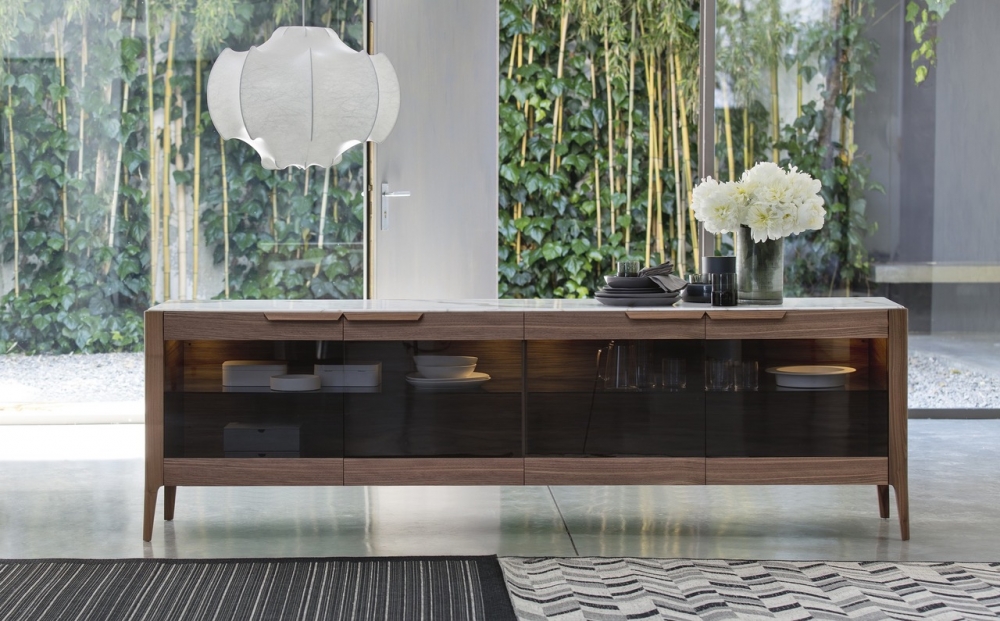 ATLANTE 6 is a sideboard from the  ATLANTE collection, crafted in solid canaletta walnut and featuring four smoked glass doors and an internal glass shelf. The smoked glass doors allow you to feature the objects within the cabinet, whilst retaining elegance, with the subtle shading of the glass and internal LED lighting. The design can be customised to suit your interior, with the cabinet‚Äôs top available in marble, wood or frosted backcoated glass.