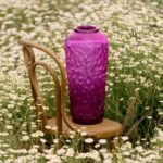 M√õRES large vase, fuchsia crystal. The M√õRES (Blackberries) vase exhibits an abundance of berries jealously protected intertwined brambles. An invitation to a dreamlike walk in the under bush.  The satin-finished crystal highlights the finely chiseled relief of this decorative masterpiece, available in green, fuchsia or black, each limited to an edition of 188 pieces. The bramble allures us with its lengthy limbs, inviting us to touch; yet prudence is required. Any attempt of resistance is in vain.