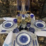 Beautiful table set by JUAN CARLOS BEK with the IN BLOOM collection designed by ZEMER PELED.The IN BLOOM collection by  ZEMER PELED is the result of an encounter between a talented young artist and exceptional craftsmanship. During her residency at the Manufacture Bernardaud, ZEMER PELED  spent time observing and understanding the complexity of creating a porcelain piece. It is with great enthusiasm that she became interested in the know how of decoration, alongside an expert who has been working at Bernardaud for more than 30 years. She learned to perform a quick, precise gesture and to perfectly control the pressure of her brush to achieve the desired effect: a decor where you feel the gesture and texture.