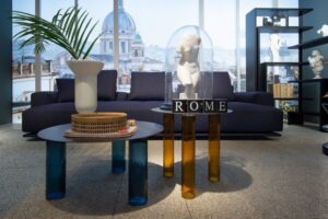 SMALL TABLE ECHINO BY SEBASTIAN HERKNER 2019, SMALL TABLES ARE THREE-LAYERED BLOWN GLASS LEGS IN THE SHADES SMOKY GREY, LIGHT- BLUE, AMBER OR BLUE. STEEL SHEET TOP, 4 MM THICK, WITH EITHER NATURAL OR BLACK NICKEL-SATIN FINISH OR MIRROR TOP, 5 MM THICK.