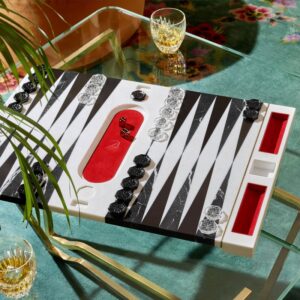Designed by MARCEL WANDERS STUDIO in a numbered edition for Baccarat, the BACKGAMMON GAME shows a new precious look. Board in inlaid marble, dice, doubling cube and pieces in crystal.  Live with passion, have fun, forget the rest. Being together and enjoying precious time with friends. With his imaginative style, light-hearted universe and joy of living, MARCEL WANDERS STUDIO has transformed Baccarat into a playground of glamour.
