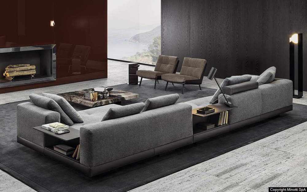 CONNERY seating system by RODOLFO DORDONI, designed in 2020. The leather bands of the structural base, sewn together with straps and marked out by stitching that add rhythm to the design, are made with the same technique used in fine leather luggage-making. The same concept of high-end leather goods also inspires the freely adjustable headrests