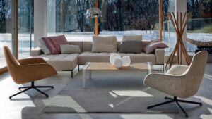 SOFA ALFA  BY EMAF PROGETTI 1999, ARMCHAIRS KENT BY LUDOVICA+ ROBERTO PALOMBA 2013  G CLOTHES -STAND SCIANGAI BY DE PAS, D'URBINO, LOMAZZI -1973