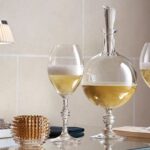 JCB PASSION champagne decanter. Baccarat unveils its very first champagne decanter. Signed JEAN-CHARLES BOISSET, this exclusive creation exalts the finesse of the bubbles and reveals the depth of the aromas. Served in the PASSION decanter, the champagne increases the taste sensations and illuminates the table with golden shades. The Baccarat lifestyle experience, in all its splendor, for sparkling moments.