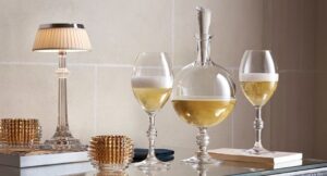 JCB PASSION champagne decanter. Baccarat unveils its very first champagne decanter. Signed JEAN-CHARLES BOISSET, this exclusive creation exalts the finesse of the bubbles and reveals the depth of the aromas. Served in the PASSION decanter, the champagne increases the taste sensations and illuminates the table with golden shades. The Baccarat lifestyle experience, in all its splendor, for sparkling moments.