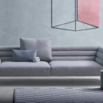 MONOBLOC SOFA BOTERO BY DAMIAN WILLAMSON 2016.POLISHED OR BLACK PAINTED ALUMINUM ALLOY FEET. STEEL FRAME. ELASTIC STRIPS SUSPENSION. BACKREST AND SEAT UPHOLSTERED IN GRADUATED POLYURETHANE/HEAT-BOUND POLYESTER FIBRE. REMOVABLE COVER IN FABRIC OR LEATHER. THE SOFA CAN BE EQUIPPED WITH CUSHIONS  UPHOLSTERED IN POLYURETHANE/DACRON DU PONT OR IN GOOSE DOWN ‚Äì 100% PURE MATERIAL. UPON REQUEST THE SEWING EDGE OF THE ARMREST, BACKREST AND CUSHIONS IS AVAILABLE IN DARK GREY GROSGRAIN.