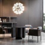 SHELLEY DINING ARMCHAIR BY GAMFRATESI easily combines compact proportions with a contemporary aesthetic taste.