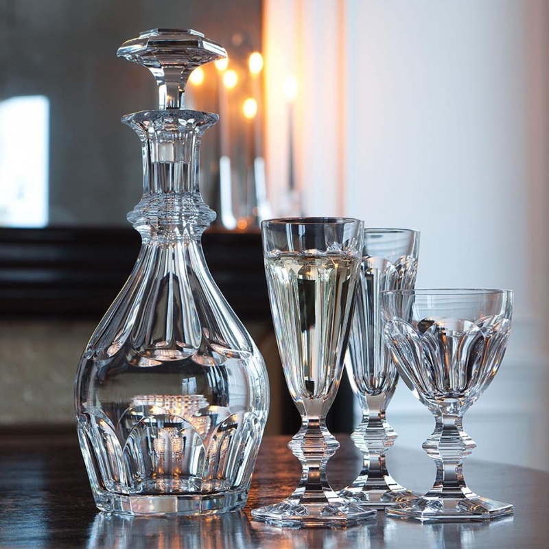 HARCOURT collection.Since its creation in 1841, the storied and elegant HARCOURT 1841 stemware has been selected by Pope John-Paul II the Queen of Thailand, the King of Morocco, and many other important figures. This clear crystal HARCOURT 1841 decanter has an exquisite silhouette. Baccarat‚Äôs craftsmanship is apparent from every angle, as the architectural form creates extra visual depth. The classical shape has a requisite HARCOURT 1841 hexagonal base and refined beveled cuts. The diamond-cut stopper crowns the decanter with sophistication. It is available in two sizes, small and large. The HARCOURT 1841 collection extends to highballs, tumblers, and champagne flutes for the smoothest of drinking experiences.