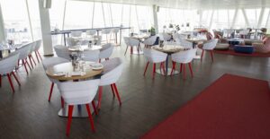 RIFT CHAIR AND FJORD STOOL BY PATRICIA URQUIOLA; JUJU SMALL ARMCHAIR BY EDWARD VAN VLIET - AC HOTEL BELLA SKY COPENAGHEN, DENMARK, 2016  INTERIORS: HOLMRIS.DESIGNBROKERS