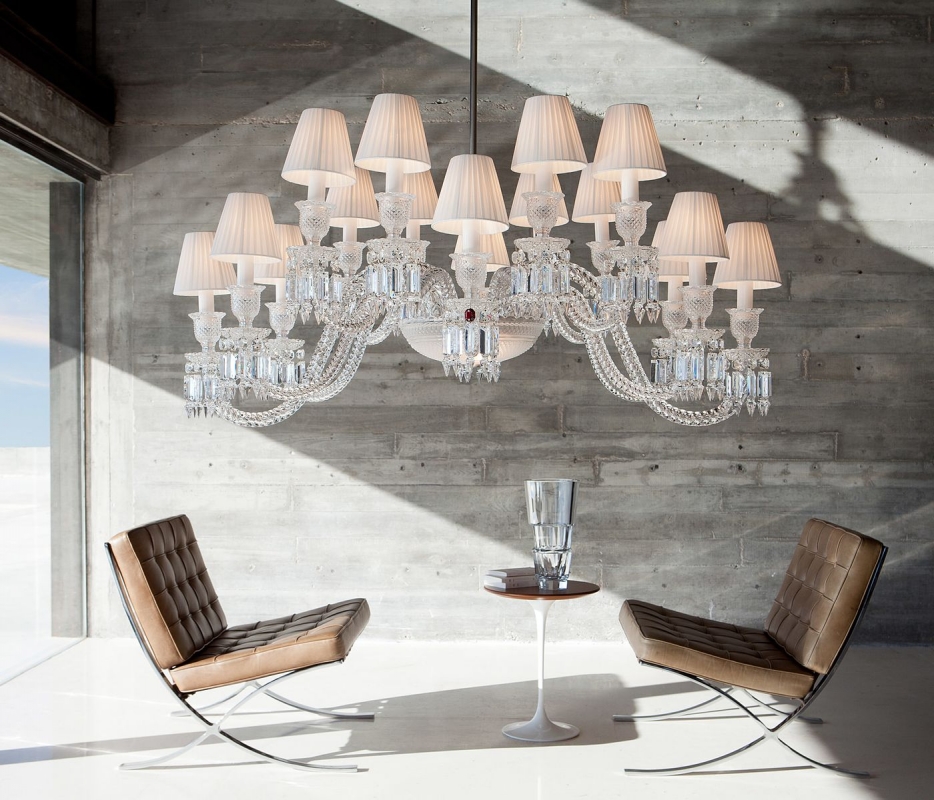 Crystal chandelier 16 lights ELLIPSE - designer ARIK L√àVY. Inspired by cold-worked crystal, the chandelier references the magical malleability of the crystal form. The Z√âNITH ELLIPSE shakes up the traditional assembly principles, notably with its slightly staggered branches that evolve from round to oval through anamorphosis. A feat of outstanding craftsmanship, the Clear crystal chandelier can be adjusted to any height. The 16-lights may be adorned with white pleated taffeta lampshades (must be ordered separately).