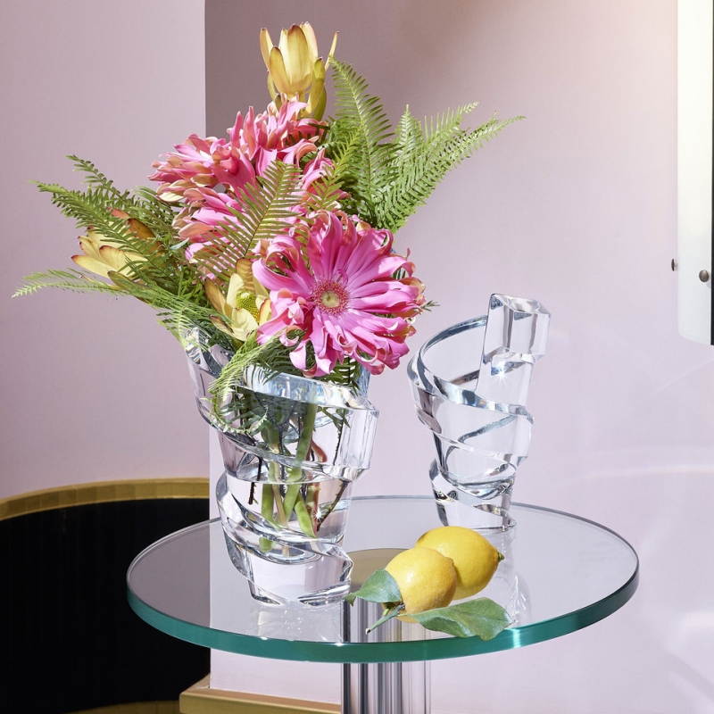 SPIRALE vase. Like a ribbon fluttering in the wind, the SPIRALE vase designed by THOMAS BASTIDE enhances the magic of crystal with its enchanting swirl.With superimposed winding diagonals similar to the architectural scrolls of the Guggenheim museum in New York, the SPIRALE vase enhances every floral composition.
