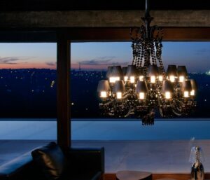 Crystal chandelier 24 lights Z√âNITH NOIR - designer PHILIPPE STARCK. Available in 2 sizes and the number of lights ranges  from 6 to 24.