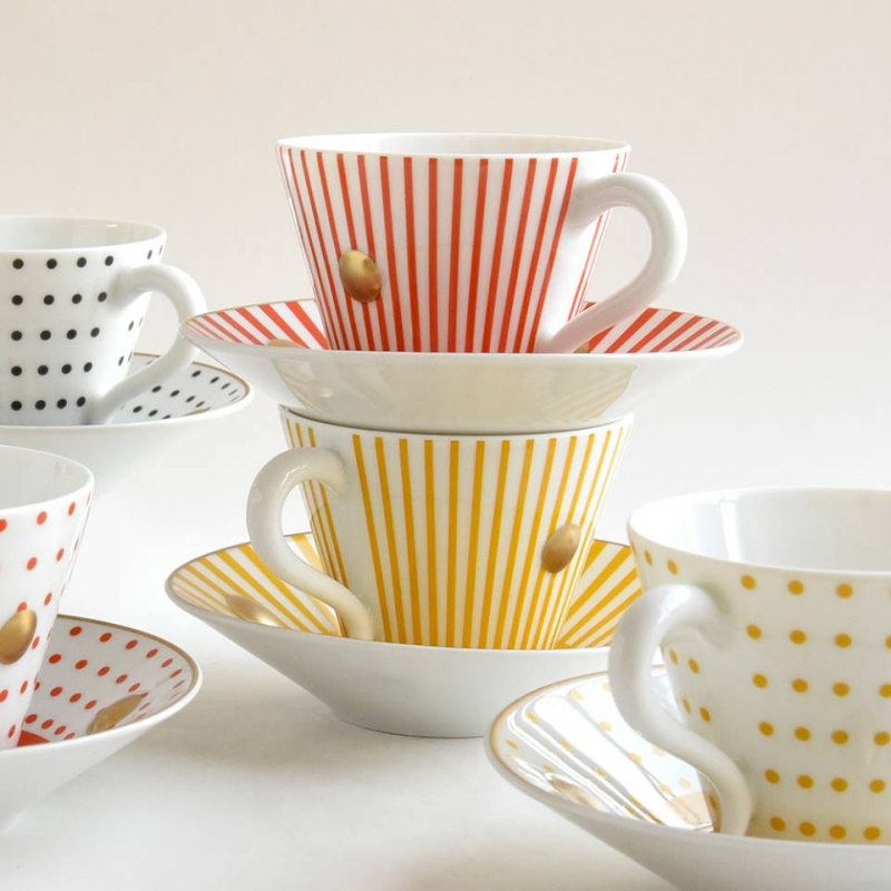 PORCELAIN TABLEWARE DELPHOS AND KNOSSOS.TO CELEBRATE THE 25TH ANNIVERSARY OF THIS ICONIC CUP, OLIVIER GAGN√àRE HAS REVISITED THE MODEL BY DRESSING IT WITH A NEW DOTS AND PINSTRIPES DECOR, AVAILABLE IN 4 COLORS. BY NAMING IT DELPHOS AND KNOSSOS, HE PERPETUATES THROUGH ALL HIS COLLECTIONS AT BERNARDAUD, THE TRIBUTE TO THE ISLANDS OF THE MEDITERRANEAN SEA AND THE BEAUTY OF THE GREEK WORLD.