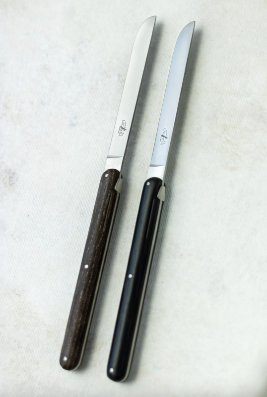 ANDR√âE PUTMAN ebony table knives, set of 2.Before bringing her distinctly feminine and pure touch to a collection of FORGE DE LAGUIOLE¬Æ knives, ANDR√âE PUTMAN pursued a career as a pianist, like her mother, who was a concert performer. Her free-spirit is omnipresent in her work. She founded her own company, Ecart, in 1978 specializing in the decoration and re-editing furniture of the 1930s. Her designs are both strong and straight-forward. FORGE DE LAGUIOLE¬Æ ASKED her to create a