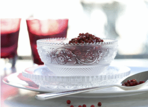 The  Clear crystal ARABESQUE dessert plate has a great variety of detailing, which accentuates Baccarat‚Äôs striking artistry and savoir-faire. The scalloped edges rise and fall in tiny waves.  Just below, a thick belt of geometric swirls ‚Äîa motif embellished with stars and acanthus leaves‚Äîwreathes around the plate. This intricate garland is hemmed in by the Clear crystal crosshatching that decorates the underside of the dessert plate. Created for Baccarat in the 19th century, this model originally encompassed a complete table set (with jug, decanter, goblets and various stemmed glasses). Today, the ARABESQUE collection has been pared down to the dessert plates and bowl, both of which share incredible and elaborate detailing.