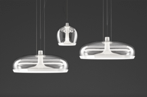 AURELIA pendant lamp designed by PATRICK JOUIN. Aurelia is an elegant object made of spun metal and hand-blown glass. Dual, user replaceable LED light sources (available in 2700K and 3000K) can be controlled independently, creating soft direct light and surprisingly unexpected reflections of indirect light. Smart disassembly system to remove the glass diffuser for quick and easy cleaning.